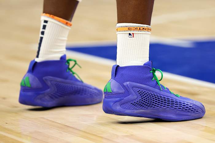 Minnesota Timberwolves guard Anthony Edwards' blue and green adidas sneakers.